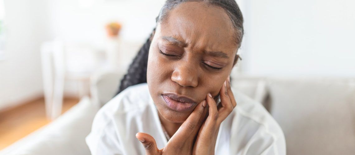 Woman experiencing dental pain