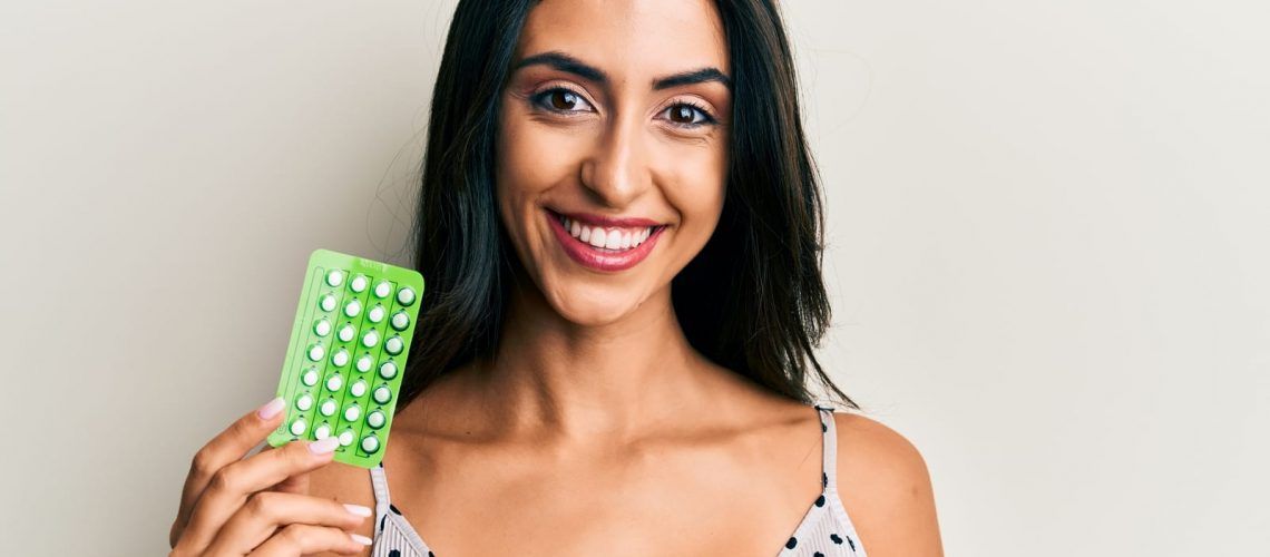 Smiling Woman with Birth Control Pills